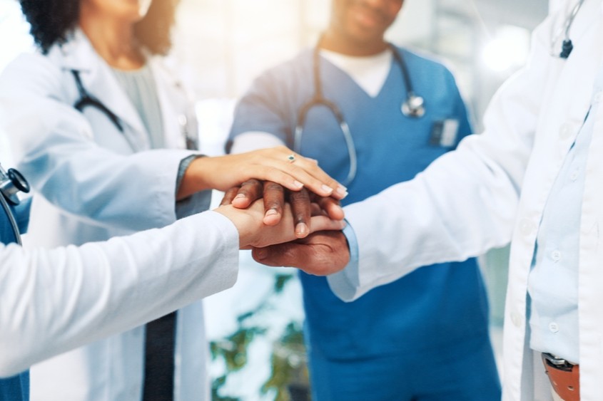 Hospital,,Nurses,And,Doctors,With,Hands,For,Huddle,,Teamwork,And